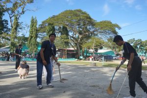 Faculty assisting cleanup